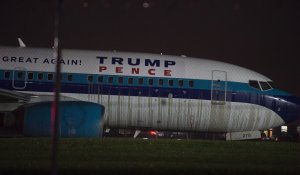 The plane that was carrying Republican vice presidential nominee Mike Pence sits on the runway at New York's LaGuardia Airport October 27, 2016 in New York. (Credit: DON EMMERT/AFP/Getty Images)