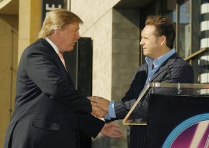 Donald Trump is greeted by producer Mark Burnett at the ceremony honoring Trump with a star on the Hollywood Walk of Fame on Jan. 16, 2007, in Hollywood. (Credit: Vince Bucci/Getty Images)