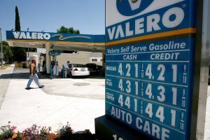 A driver fills up at a Valero gas station in Pasadena. (Credit: David McNew/Getty Images)