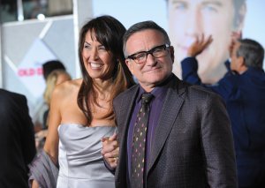 Actor Robin Williams, right, and Susan Schneider Williams arrive at the premiere of "Old Dogs" at the El Capitan Theatre on Nov. 9, 2009 in Hollywood, California. (Credit: Jason Merritt/Getty Images)