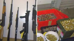 Photos displayed at an LAPD news conference show ammunition and firearms allegedly found at the home of Mark Feigin in October 2016. (Credit: KTLA)