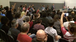 Protesters shout "shut it down" at a Los Angeles Police Commission meeting on Oct. 4, 2016, (Credit: KTLA)