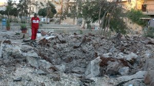 A Syrian medical staff member inspects the damage at the site of a medical facility after it was reportedly hit by Syrian regime barrel bombs on Oct. 1, 2016, in Aleppo. (Credit: Thaer Mohammed/AFP/Getty Images)