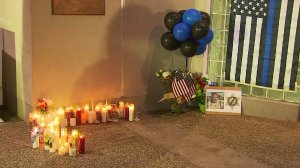 A growing memorial was seen Thursday morning outside the Lancaster sheriff's station. (Credit: KTLA)