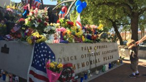 A memorial is seen outside the Palm Springs Police Department on Oct. 9, 2016 for Officers Jose Gilbert Vega and Lesley Zerebny. (Credit: CNN)