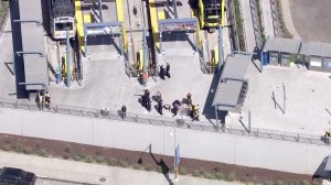 Paramedics tend to a man injured in a deputy-involved shooting at the Downtown Santa Monica Metro station on Oct. 4, 2016. (Credit: KTLA)