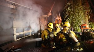 Firefighters battle a blaze at a large home in Mount Washington on Oct. 20, 2016. (Credit: LAFD / Harry Garvin)