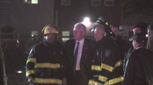 Mike Pence poses for a quick photo with firefighters who responded after his campaign plane skidded off the runway at LaGuardia Airport on Oct. 27, 2016. (Credit: pool via CNN)