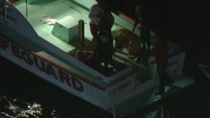 Two people were rescued after a boat crashed and capsized near Marina del Rey on Oct. 12, 2016. (Credit: KTLA)