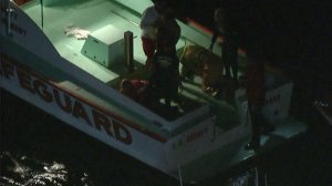 Two people were rescued after a boat crashed and capsized near Marina del Rey on Oct. 12, 2016. (Credit: KTLA) 