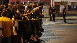 A crowd gathers at Western Avenue, where they voiced their frustration with police. (Credit: Gary Coronado / Los Angeles Times)