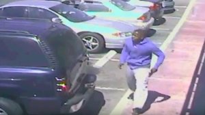 Surveillance video released by the LAPD appears to show a man with a gun prior to a fatal police shooting in South Los Angeles on Oct. 1, 2016. 