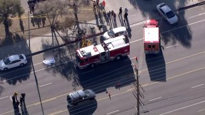 Police and firefighters respond to a shooting in Sylmar on Oct. 25, 2016. (Credit: KTLA)