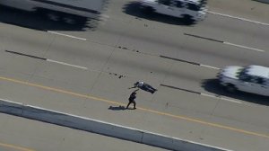 A man collapses on a Texas interstate after being shot with a stun gun. (Credit: KTVT via CNN)