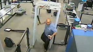 An image provided by CNN on Oct. 31, 2016 shows a man with a machete storming a TSA checkpoint in New Orleans in 2015.