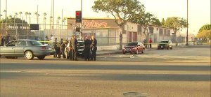 Los Angeles Police officers respond to a fatal shooting near a high school in Wilmington on Oct. 25, 2016. (Credit: KTLA)