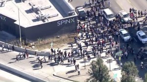 Students briefly attempted to run onto a 110 Freeway on-ramp during a protest on Nov. 10, 2016. (Credit: KTLA) 