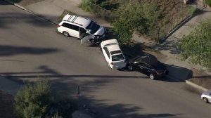 Three cars were involved in a crash near the scene of a shooting in Azusa on Nov. 8, 2016. It was not immediately clear whether the two incidents were related. (Credit: KTLA)