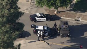 Police and SWAT vehicles were in residential area of Azusa following a shooting on Nov. 8, 2016. (Credit: KTLA) 