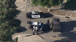 Police and SWAT vehicles were in residential area of Azusa following a shooting on Nov. 8, 2016. (Credit: KTLA)