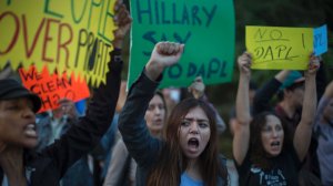 Activists demonstrate near a Hillary Clinton presidential campaign fundraiser with President Barack Obama to call for a halt to the Dakota Access Pipeline project on Oct. 24, 2016 in Beverly Hills. (Credit: DAVID MCNEW/AFP/Getty Images)