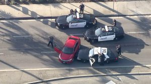 A male driver surrendered to police in Santa Fe Springs after a multi-county pursuit on Nov. 22, 2016. (Credit: KTLA)