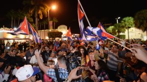 Miami residents celebrate the death of Fidel Castro on November 26, 2016. (Credit: Gustavo Caballero/Getty Images)