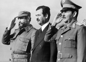  Iraqi vice-president Saddam Hussein (C), stands with Cuban President Fidel Castro (L) and Defense minister General Raul Castro (R), 30 January 1979 in Havana, during his visit to Cuba.  (Credit:AFP/Getty Images)