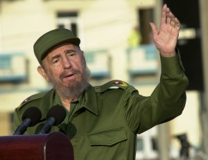 Cuban President Fidel Castro gives a speech in front of the U.S. Interest Section May 14, 2004 in Havana. Castro led a massive protest march against new U.S. moves aimed at speeding the end of his communist rule, and raised the prospect of a feared U.S. invasion. (Credit: Jorge Rey/Getty Images)