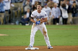 Corey Seager of the Los Angeles Dodgers reacts after he slides into second base safe after a RBI base hit in the third inning against the Chicago Cubs in game three of the National League Championship Series at Dodger Stadium on Oct. 18, 2016. (Credit: Jeff Gross/Getty Images)