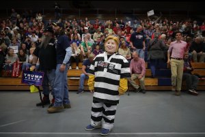 Tristan Clancy, 10, of South Saint Paul, Minnesota, dresses as Democratic presidential nominee Hillary Clinton in prison garb while attending a rally for Republican presidential nominee Donald Trump Nov. 1, 2016, in Eau Claire, Wisconsin. (Credit: Chip Somodevilla/Getty Images)