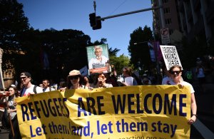 People march in an event organized by Doctors for Refugees to demand humane treatment of asylum seekers and refugees, in Sydney on Nov. 5, 2016. (Credit: Peter Parks/AFP/Getty Images)