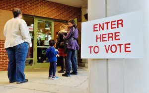 A voting line trails outside of a precinct as voters wait to get in on November 8, 2016 in Durham, North Carolina. (Credit: Sara D. Davis/Getty Images)