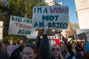 Demonstrators hold up signs during a "Love Rally" march in New York on November 11, 2016, to protest the election of US President-elect Donald Trump. / AFP / Bryan R. Smith (Photo credit should read BRYAN R. SMITH/AFP/Getty Images)