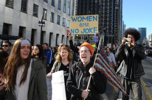 Demonstrators march to Trump Tower in Chicago on November 12, 2016, as marches continue accross the US against the policies of US President-elect Donald Trump. Americans spilled into the streets Saturday for a new day of protests against Trump, even as the president-elect appeared to back away from the fiery rhetoric that propelled him to the White House. / AFP / Nova SAFO (Photo credit should read NOVA SAFO/AFP/Getty Images)