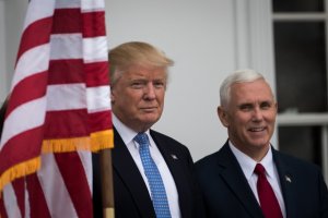 President-elect Donald Trump and vice president-elect Mike Pence listen to a question from the press regarding the musical 'Hamilton' before their meeting with investor Wilbur Ross at Trump International Golf Club, November 20, 2016 in Bedminster Township, New Jersey. (Credit: Drew Angerer/Getty Images)