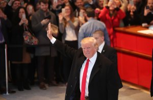 President-elect Donald Trump walks through the lobby of the New York Times following a meeting with editors at the paper on November 22, 2016 in New York City. Trump, who has held meetings with media executives over the last few days, has often had a tense relationship with many mainstream media outlets. (Credit: Spencer Platt/Getty Images)