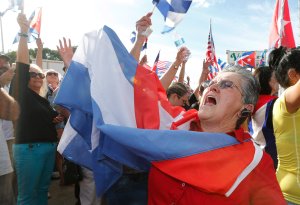 Cuban Americans celebrate in the streets of Miami's Little Havana the death of Cuban dictator Fidel Castro on November 26, 2016. (Credit: Rhona Wise/AFP/Getty Images)