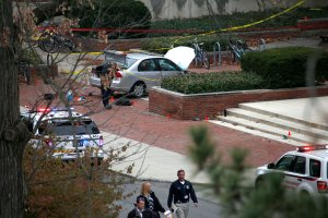 Police investigate the scene where a young man used a car to crash into a group of students outside of Watts Hall on the Ohio State University campus on Nov. 28, 2016, in Columbus, Ohio. (Credit: Kirk Irwin/Getty Images)