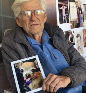 Roger LeClair holds up a photo of Lola on Nov. 18, 2016. (Credit: KTLA)