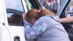 The mother of a teen cyclist arrives at the scene where her son was killed in Pacoima on Nov. 15, 2016. (Credit: KTLA)