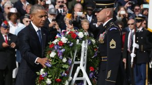 President Barack Obama participates in a wreath-laying ceremony at the Tomb of the Unknown Soldier at Arlington National Cemetery on Veterans Day November 11, 2016 in Arlington, Virginia. (Credit: Alex Wong/Getty Images)