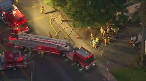 Firefighters respond to a truck crash into a building in Oxnard on Nov. 7, 2016. (Credit: KTLA)