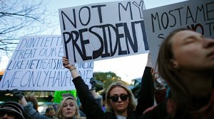 A woman holds a poster during a rally against President-elect Donald Trump in Union Square on November 12, 2016, in New York. (Credit Kena Betancur /AFP/Getty Images)