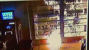 Surveillance video shows Sunny Liquor and Market recently being set on fire. (Credit: KTLA)
