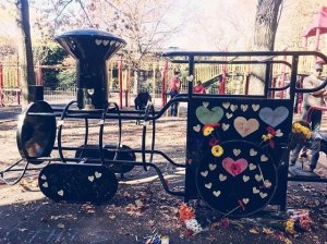 Playground equipment at Adam Yauch Park in New York has since been painted over and hearts and flowers have been placed on it. (Credit: CNN)