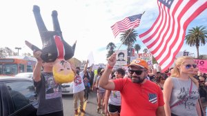 Demonstrators march to protest against President-elect Donald Trump in Los Angeles on November 12, 2016.  (Credit: Ringo Chiu/AFP/Getty Images)