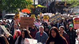 Demonstrators march to Trump Tower in Chicago on November 12, 2016, as marches continue across the U.S. against the policies of President-elect Donald Trump. (Credit: Nova Safo/AFP/Getty Images)