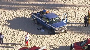 A beachgoer was hospitalized after being run over by a county truck at Venice Beach on Nov. 4, 2016. (Credit: KTLA)