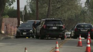 Whittier police investigate an officer-involved shooting that left a man allegedly armed with a machete dead on Nov. 16, 2016. (Credit: KTLA)